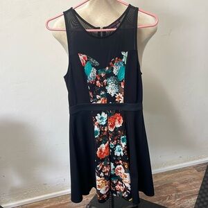 Material Girl floral black dress with mesh in front and back. Flares out